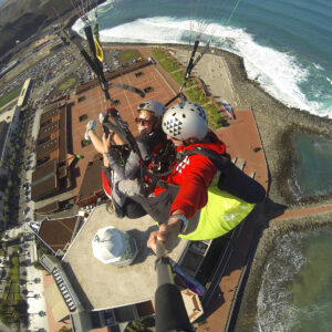 Flying paraglider over Las Canteras